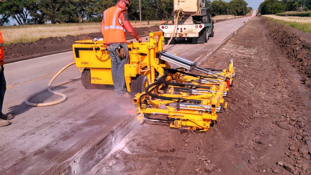 The Chester Bross crew uses an E-Z Drill 4-gang slab rider concrete drill to achieve the proper spacing.