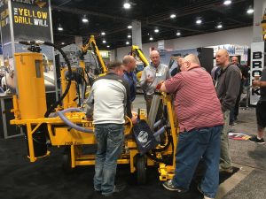 Customers gather around the new E-Z Drill Dust Collection System